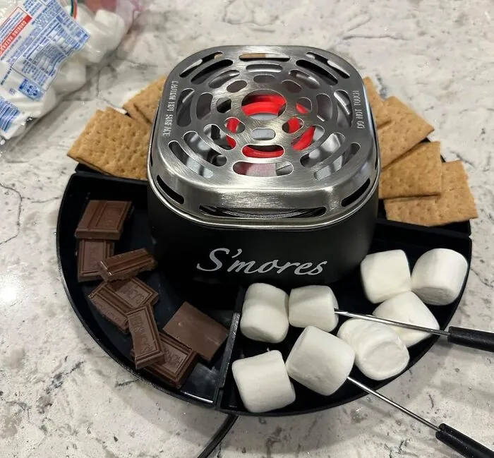 Bring The Campfire Inside And Make S'more Memories With Your Loved Ones, Courtesy Of The   <a Style="Display:inline;" Href="Https://Www.amazon.com/Nostalgia-Smm200-Stainless-Compartment-Marshmallows/Dp/B00py05vms?dib=eyj2ijoimsj9.3ztsm5wn7ni0hxlckg62su1wlgbk7wzcrmwx5k3xkre5ylhxmckdbggwwvjjmeo12jnbeswczucs14ldgm3wbh1cmkj4ch0va-C716dtzux5bdh6wy7rvtvyxjpiisknvpt8gkbos7-Ksqxnwsdxoquil5bg5luptqnlafz_odnt0coz65iisznhfk8lj2qdlqjbd_gjssc8strtwvccnvrjajr777yde622hgwt1xw.j6t7e-Xxcxvglxfaxuj4z8kq45uuimbcaatcilvnq5u&dib_tag=se&keywords=s%27mores%2bmaker&qid=1728458319&sr=8-3&th=1&linkcode=ll1&tag=bpgiraffe-20&linkid=0e04cd526e67a9cb8e3ce3050be20f73&language=en_us&ref_=as_li_ss_tl" Target="_blank"><span Style="Font: Inherit; Color: #d74b1f;"> Tabletop Indoor Electric S'mores Maker</Span>. It's All The Gooey Goodness Without The Great Outdoors!