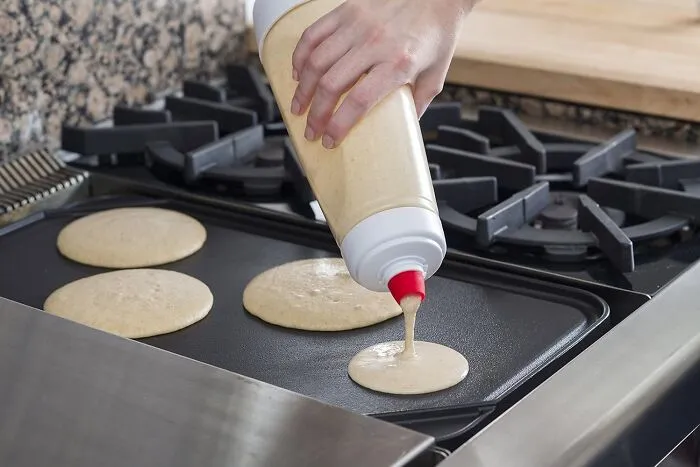 Flip Your Pancake Game And Make Breakfast A Breeze With The <a Style="Display:inline;" Href="Https://Www.amazon.com/Dp/B01jg57jj4?ascsubtag=7554166%2c3%2c28%2cd%2c0%2c0%2c0%2c900%3a2%3b974%3a3%3b1125%3a2%3b1338%3a1%3b1352%3a1%2c38723466%2c0%2c0%2cgoogle&btn_ref=srctok-Da3bd2bc8f5059b3&th=1&linkcode=ll1&tag=bpgoose-20&linkid=3e7aab9d07a39cc1640dcc13d906e9fd&language=en_us&ref_=as_li_ss_tl" Target="_blank"><span Style="Font: Inherit; Color: #d74b1f;"> Pancake Batter Dispenser And Mixer</Span>