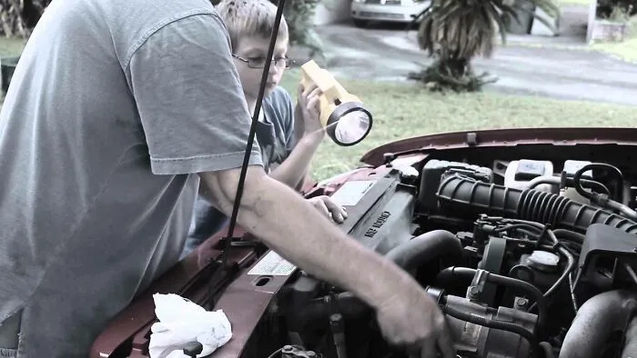 Working On The Car With Your Dad So You Can Learn How To Fix Stuff. All I Learned Was How To Hold The Flashlight And Get Yelled At