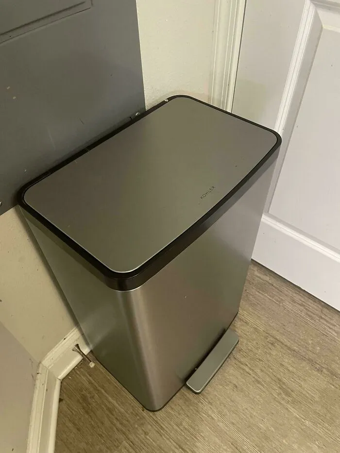 Modern metal trash can found while dumpster diving, showcasing a sleek design and high value.