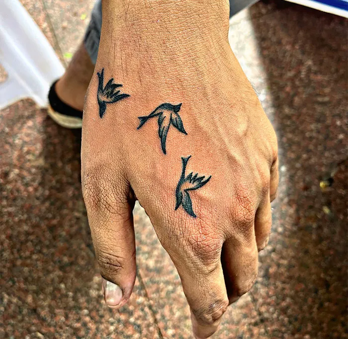 Small Swallow Hand Tattoo