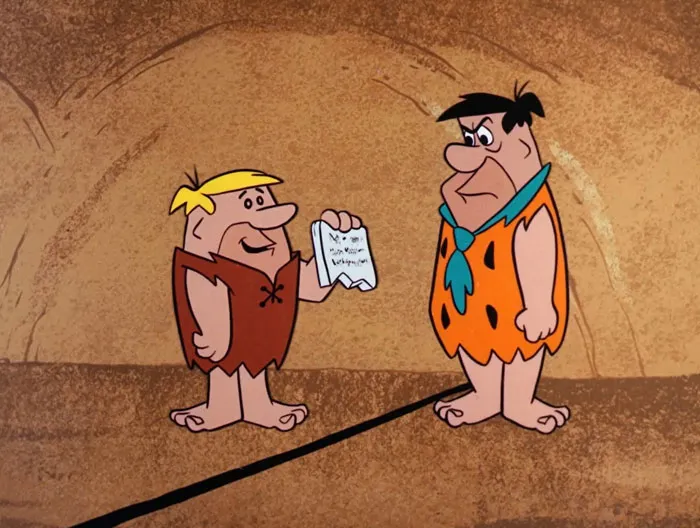 Animated iconic duos in a prehistoric setting, one holding a paper, both wearing traditional garments.