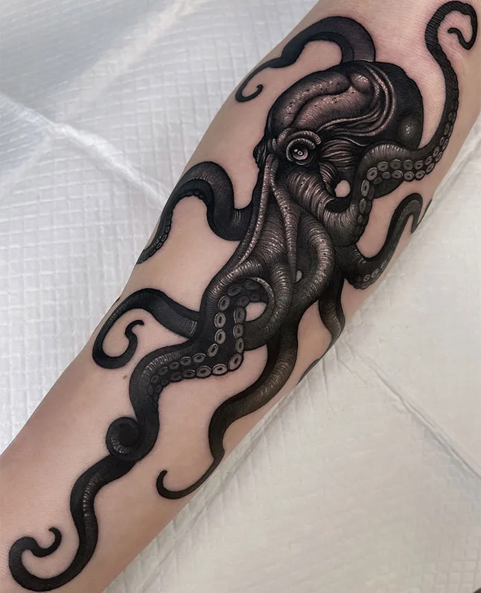 Bold Black Octopus Forearm Tattoo