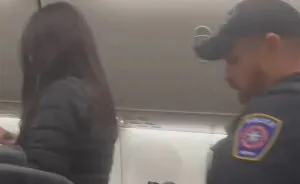 Hilarious Theme Song Accompanies Racist Woman As She’s Removed From Flight