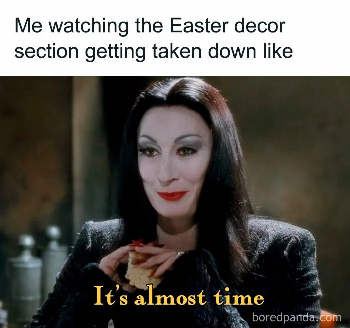 A woman in black with dark hair smiling, holding a sandwich, with text: "It's almost time." Halloween memes theme.