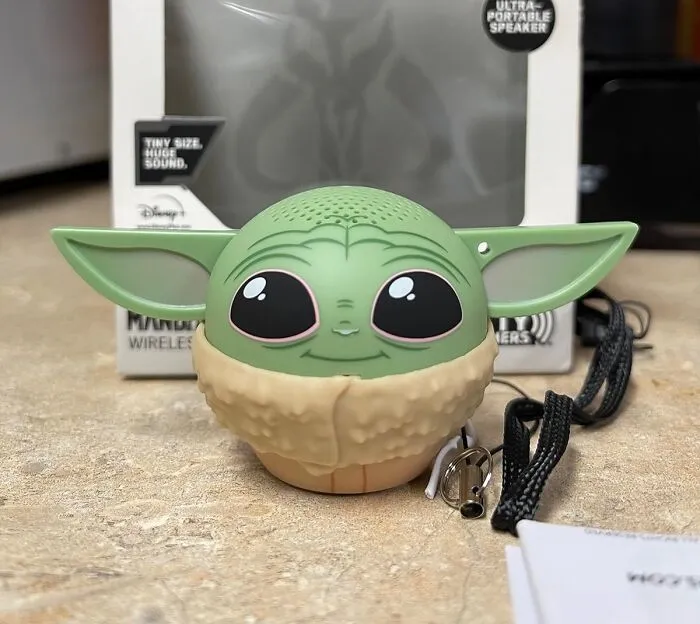 Bring The Cuteness And Charm Of The Mandalorian's Beloved Companion To Their Music Routine With The Adorable <a Style="Display:inline;" Href="Https://Www.amazon.com/Dp/B085wqmtjs?ascsubtag=6338713%2c28%2c39%2cd%2c0%2c0%2cbf-G-Ki%2c0%3a0%2c36798826%2c0%2c0%2c0&linkcode=ll1&tag=bpcrocodile-20&linkid=cf8bfb2cc076abfdcdb4ebc58b59b8e1&language=en_us&ref_=as_li_ss_tl" Target="_blank"><span Style="Font: Inherit; Color: #d74b1f;"> Grogu Mini Bluetooth Speaker</Span>, A Small But Mighty Speaker That's Sure To Delight Any Fan Of The Child (Aka "Baby Yoda")