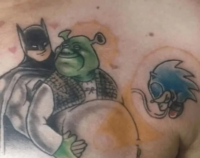 Tattoo fail featuring Batman hugging Shrek with Sonic flying nearby, illustrating a humorous blend of characters.