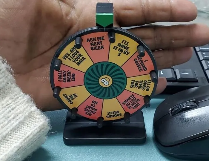 Spin Your Way To Sarcastic Satisfaction With The <a Style="Display:inline;" Href="Https://Www.amazon.com/Office-Answer-Wheel-Give-Minis/Dp/0762499427?ie=utf8&linkcode=ll1&tag=bpmelon-20&linkid=0145049314e03bb149a177641568a527&language=en_us&ref_=as_li_ss_tl" Target="_blank"><span Style="Font: Inherit; Color: #d74b1f;"> The Office Answer Wheel</Span>, A Tongue-In-Cheek Desk Toy That's Guaranteed To Provide Humorous (And Occasionally Helpful) Responses To All Your Work Queries – Because "I Don't Know" Just Got A Whole Lot Funnier!