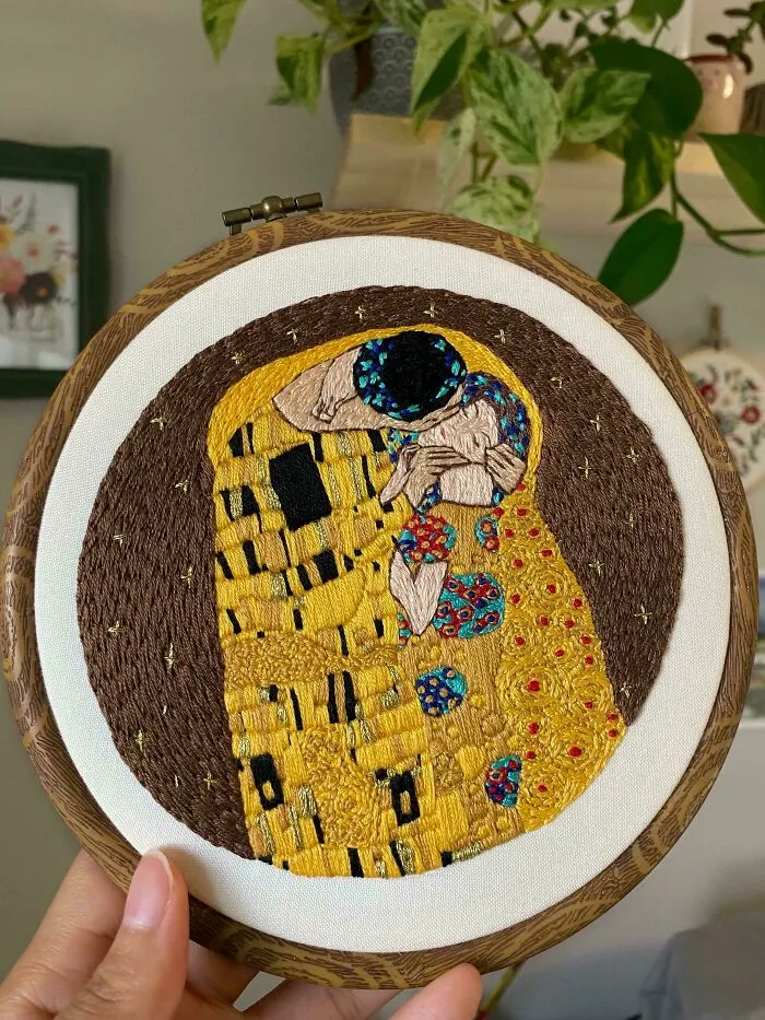 Embroidery hoop featuring detailed colorful embroidery design inspired by famous artwork, showcasing beautiful embroidery designs.