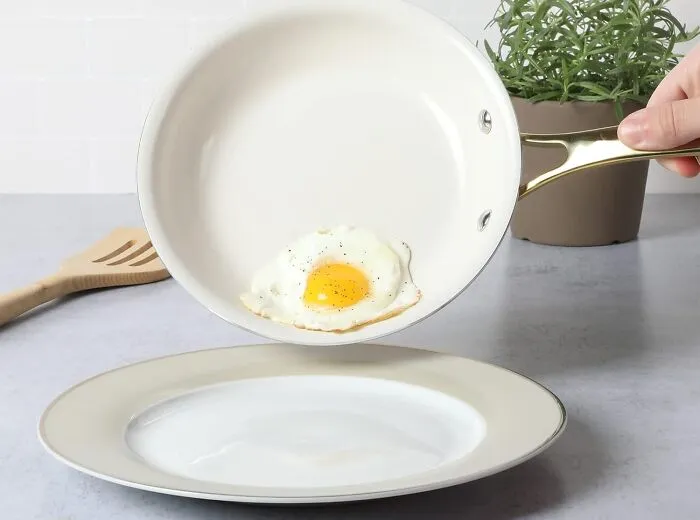 Elevate Your Cooking Style With Martha's Sophisticated <a Style="Display:inline;" Href="Https://Www.amazon.com/Stewart-Nonstick-Interior-Aluminum-Cookware/Dp/B0bnjxv9wh?ref_=ast_sto_dp&th=1" Target="_blank"><span Style="Font: Inherit; Color: #d74b1f;"> Linen White Cookware Set With Golden Handles</Span>, Where Function Meets Fabulous