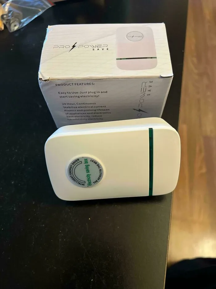 Boxed Pro Power save device placed on a table, related to spending money regrets.