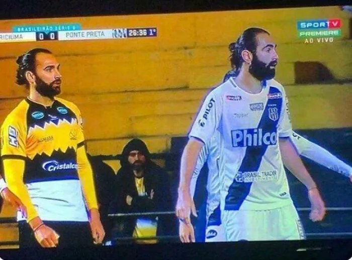 Soccer players resembling doppelgangers on the field, creating a glitch in the matrix effect during a match.