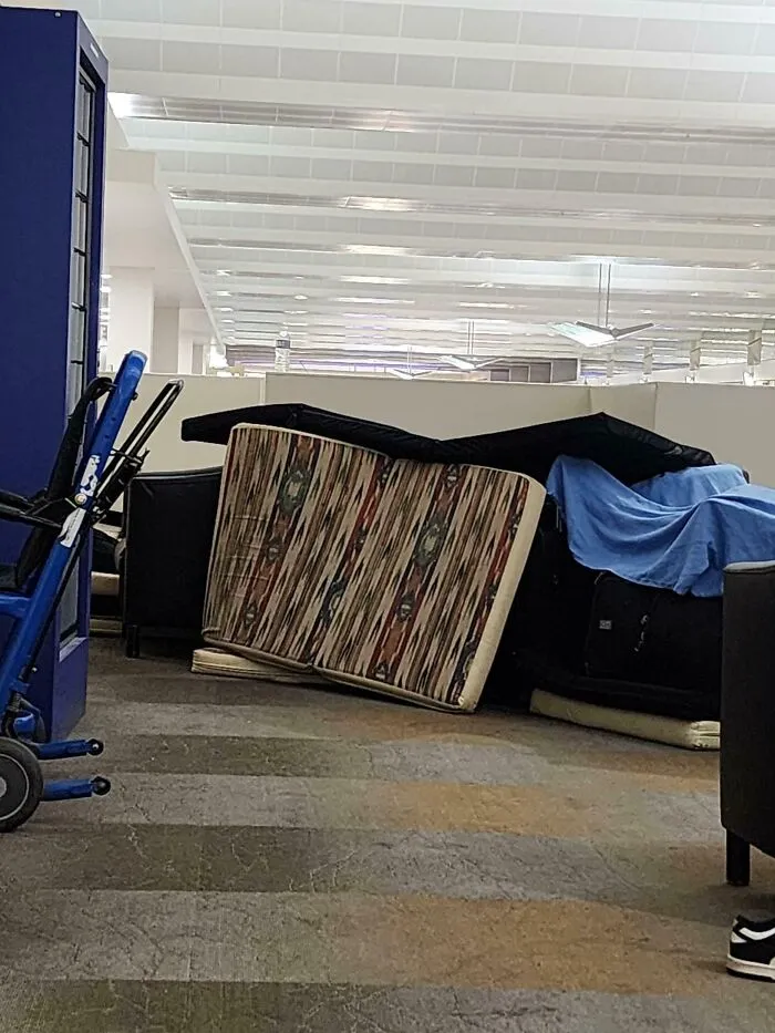 2 People Hoarding Sleep Mats At The Airport