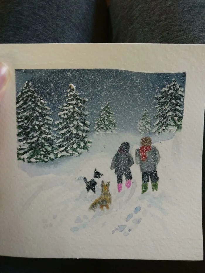 A Christmas Card My Mother In Law Made Of Me, My Partner And Our Two Dogs