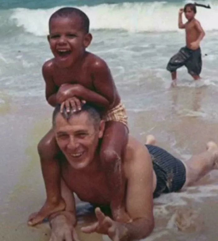 A Young Barack Obama Spending Time On The Beach With His Grandfather. 1963
