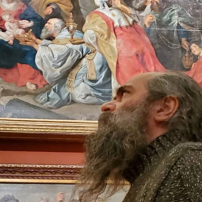 Man resembling a figure in a classical painting, showcasing uncanny doppelgangers and glitches in the matrix.