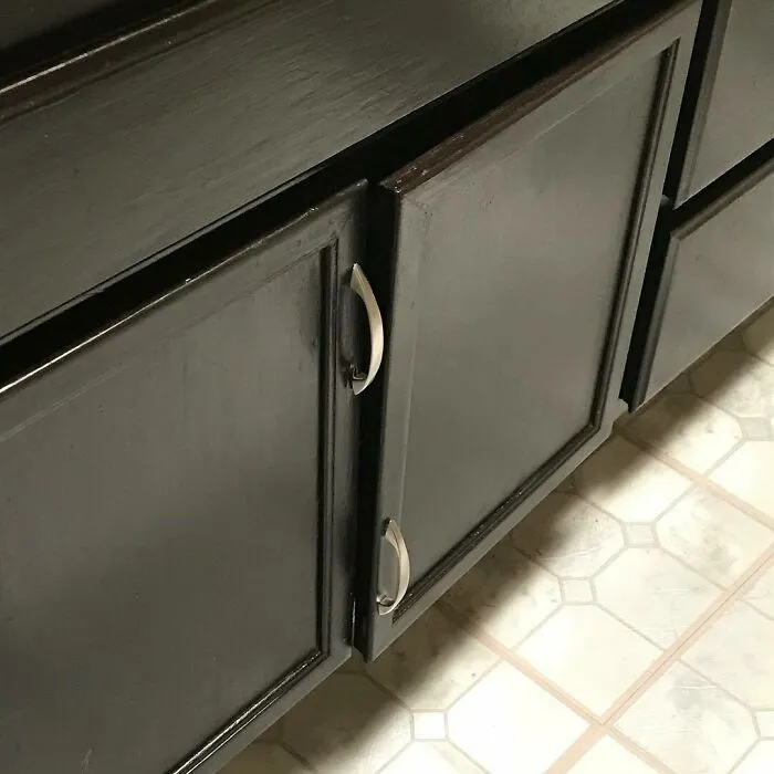 Misaligned cabinet handles show a funny home improvement fail.