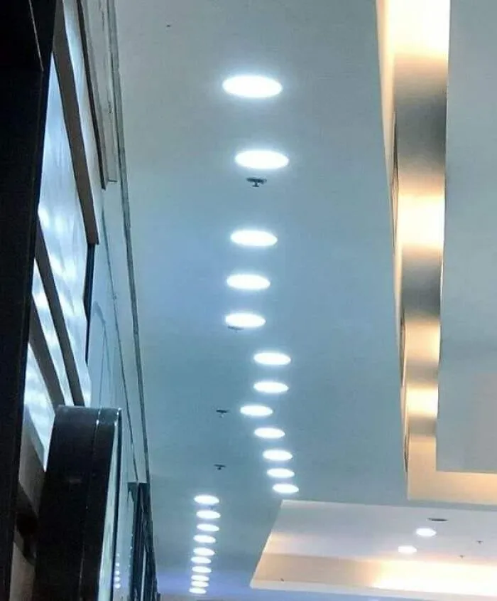 Ceiling with misaligned lights, illustrating not all engineers ensure accurate design implementation.