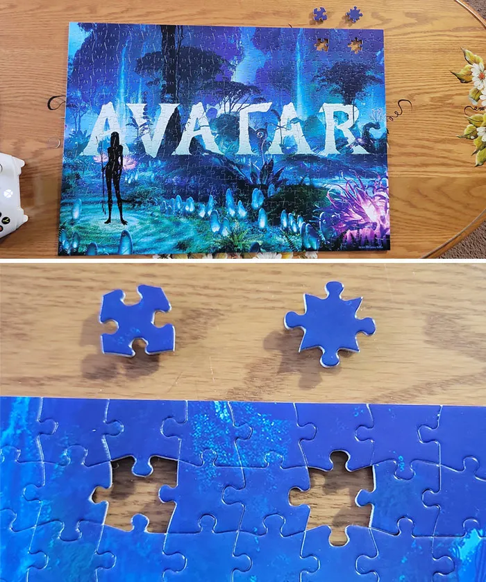 Puzzle with two missing pieces, revealing incomplete image of "Avatar," showcasing mildly infuriating irritation.