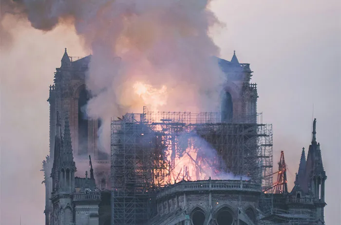 Notre-Dame Cathedral on fire, a disappointing travel destination for some visitors.