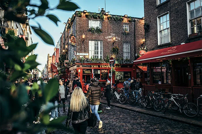Crowded street near the Temple Bar in Dublin, a hyped travel destination.