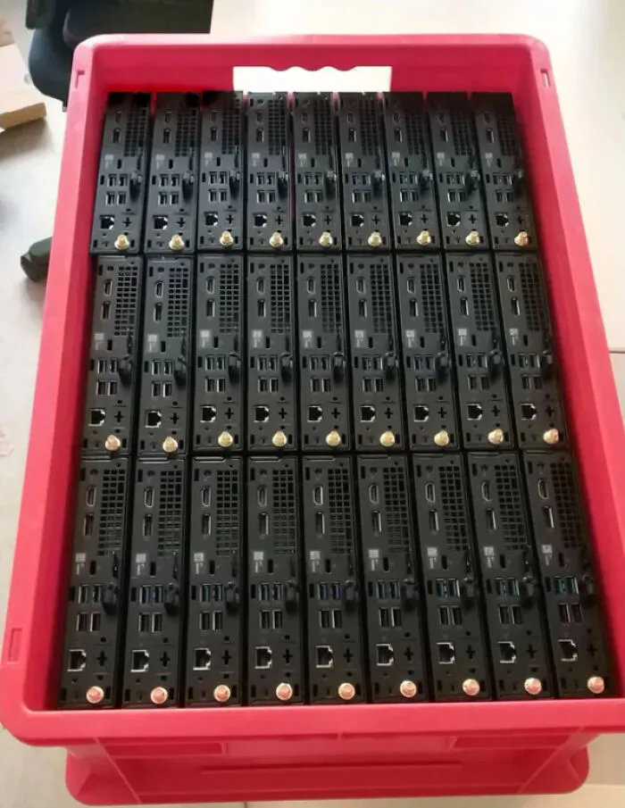 Neatly arranged electronic devices in a red crate, illustrating a satisfying perfect fit.