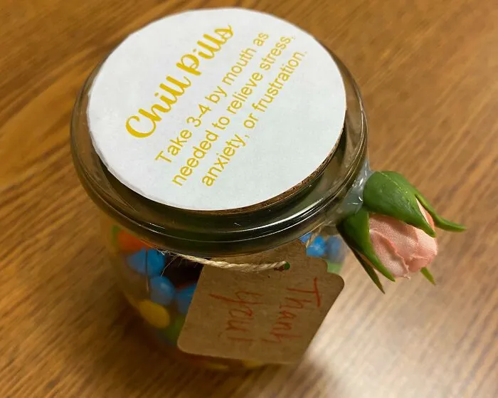 Jar labeled "Chill Pills" with colorful candies, a flower decoration, and a "Thank you" tag. Disappointing presents gift idea.