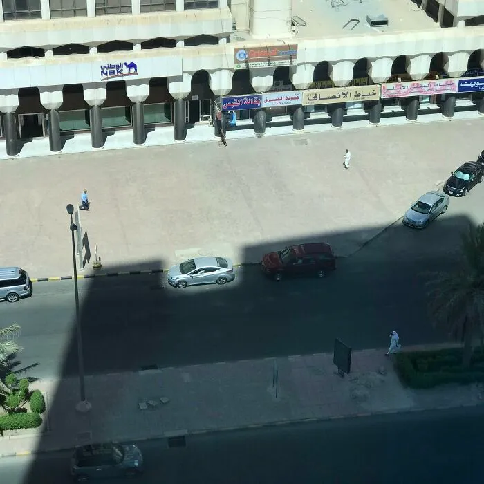 The Light Opening In The Building's Design Fits Perfectly With The Car Dimension