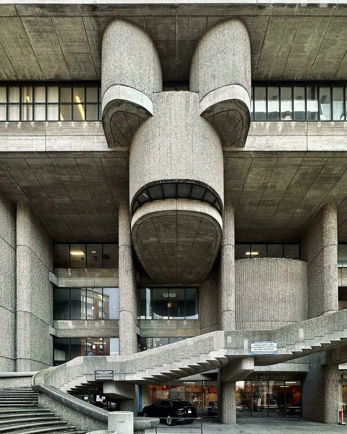 Brutalist building with ominous concrete architecture resembling a supervillain headquarters with evil auras and dark design.