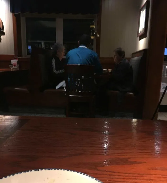 The Manager At This Restaraunt Is Breaking Up The Lobster Shells For These Two Old Ladies Who Are Celebrating One Of Their Birthdays