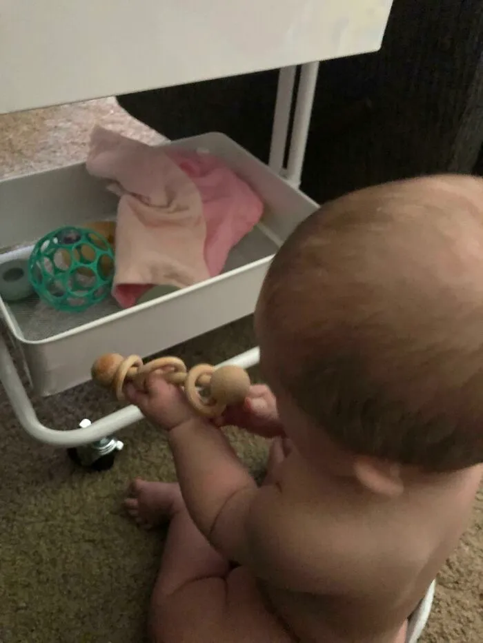 She Kept Pulling Things Out Of The Bottom Shelf Of The Diaper Cart. So I Replaced It All And Tricked Her Into Playing With Her Own Toys