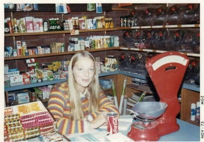 Young Lady Manning The Counter In A General Store, November, 1973