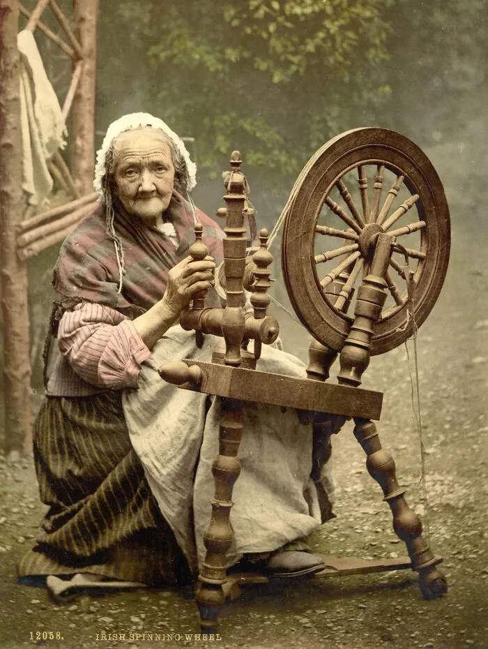 Irish Spinner And Spinning Wheel. Co. Galway, Ireland, 1890