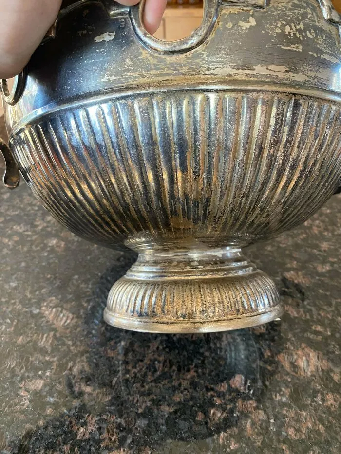 A tarnished silver bowl found while dumpster diving, showcasing a unique treasure with a potential $550 value.