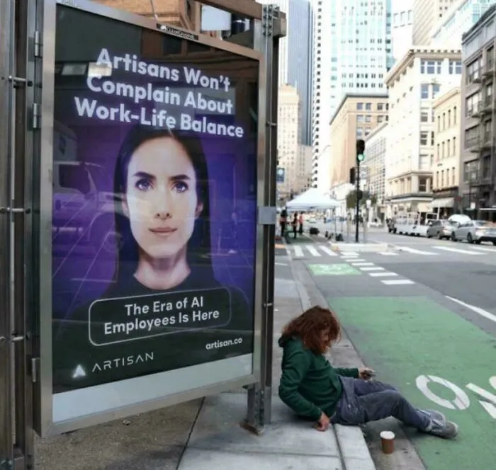 Ad for AI employees next to a person sitting on the street, conveying an oddly terrifying contrast.
