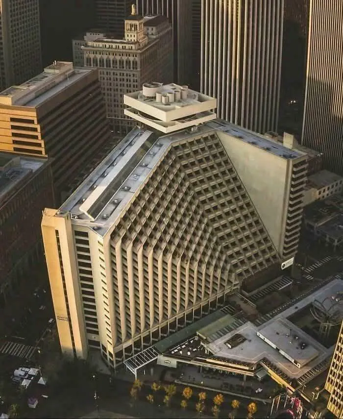A brutalist building with sharp angles and a sinister design, radiating evil aura like a supervillain headquarters.