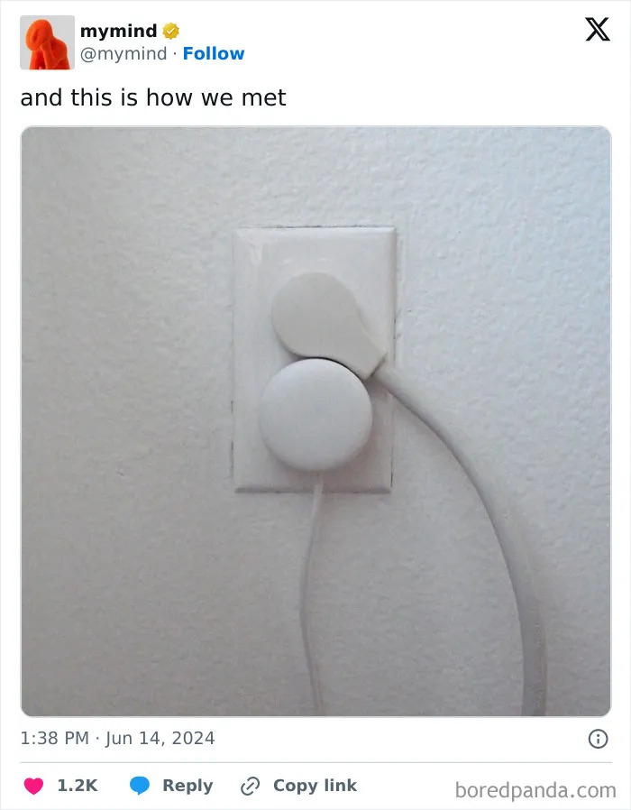 White plug perfectly fit into a socket on a white wall, showcasing satisfying alignment.