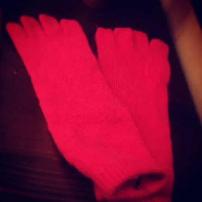 Red woolen socks as Christmas gifts symbolizing ruined holiday spirit.