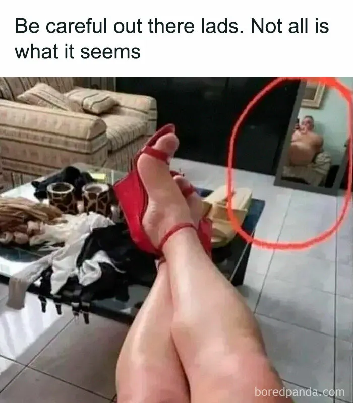 Red high heels and legs posed, with funny reflection in mirror; classic fail.