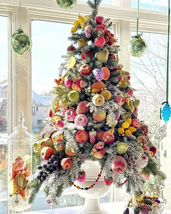 Since I Last Shared This Little Tree, I Couldn’t Resist Sweetening It Up With Just A Few More Newly Acquired Frosted Sugar Fruits And Hanging Some Ornaments In The Window To Tie In The Colors Of The Dishes That I Used To Style The Shelves That Flank The Tree. That’s The Best Part Of Decorating, Isn’t It?