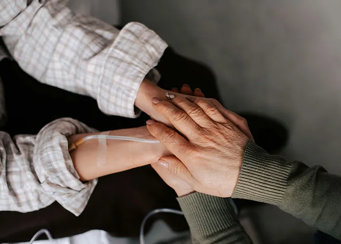 Hands offering support, representing life-changing events that shaped people's lives.