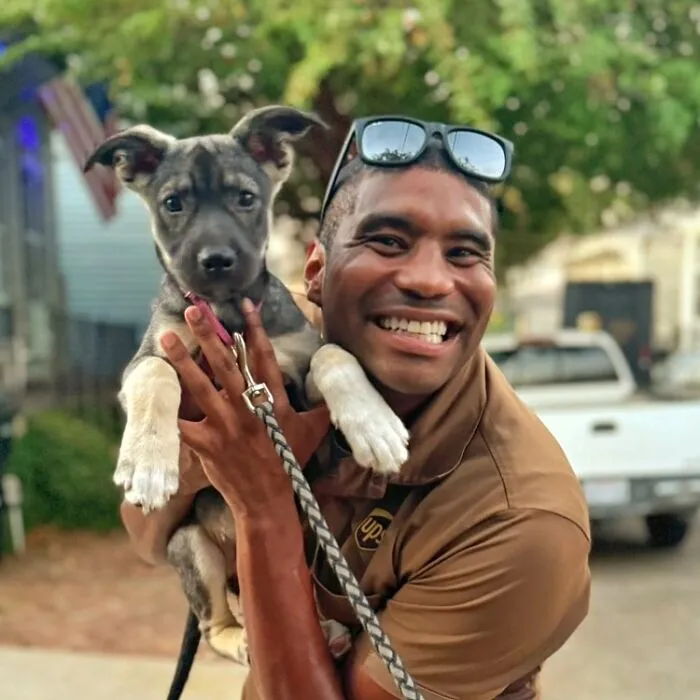 This UPS Driver's 21 New Photos With Pets Are The Dose Of Wholesome Content You Need