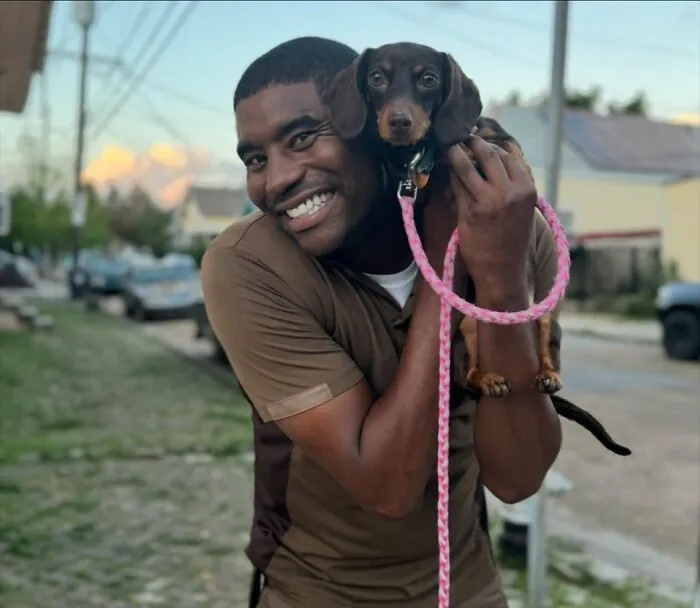 This UPS Driver's 21 New Photos With Pets Are The Dose Of Wholesome Content You Need