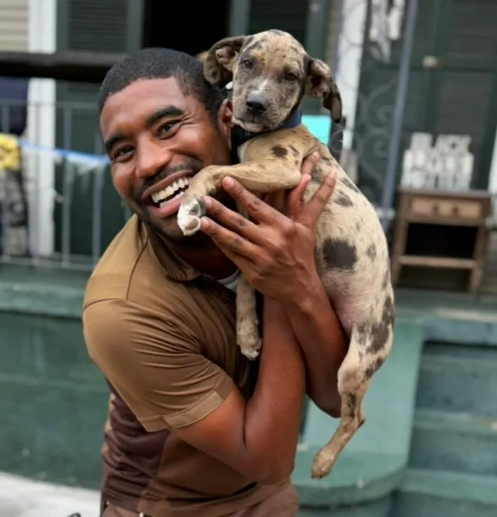 This UPS Driver's 21 New Photos With Pets Are The Dose Of Wholesome Content You Need