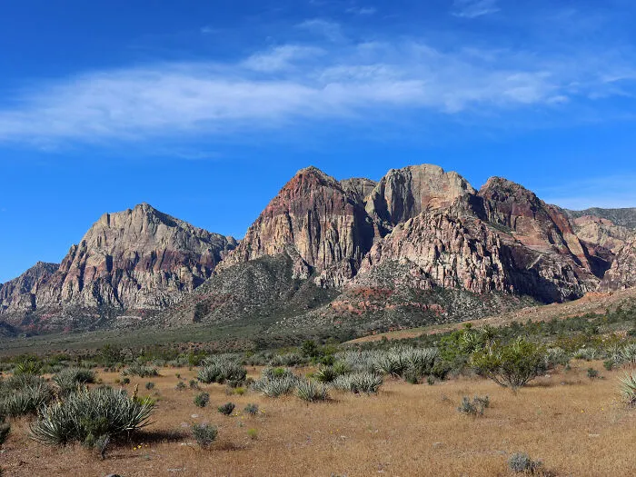 Desert landscape with rugged mountains under a clear blue sky in the States, showcasing amazing views.