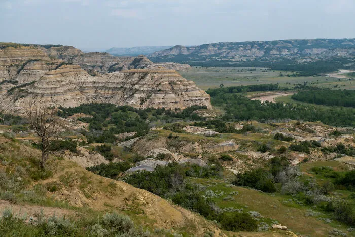 Stunning landscape showing the rugged terrain of a state park with expansive views and lush green valleys.