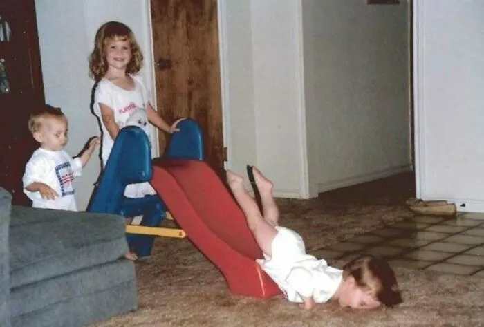 This Is A Photo Of Me Faceplanting Into The Ground After What Looks Like My Sister Pushed Me Off The Top