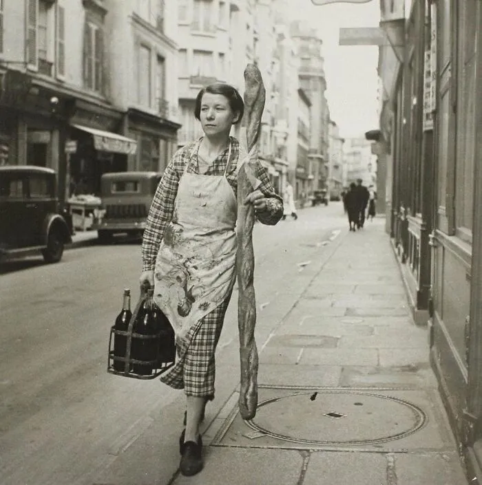 A French Woman With Her Baguette And Six Bottles Of Wine, Paris, 1945