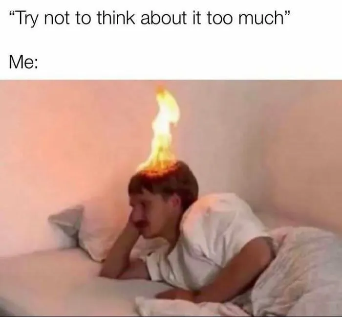 Person lying in bed with their head on fire, illustrating humor as a coping mechanism in a relatable meme format.