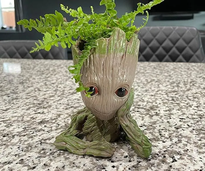 Bring A Little Groot-Ful Charm To Your Desk Or Shelf With A <a Style="Display:inline;" Href="Https://Www.amazon.com/B-Best-Guardians-Drainage-Succulents-Christmas/Dp/B07d1kvd2v?ie=utf8&th=1&linkcode=ll1&tag=bpbutterfly-20&linkid=f4bd1920f3c254273255b3136192af1a&language=en_us&ref_=as_li_ss_tl" Target="_blank"><span Style="Font: Inherit; Color: #d74b1f;"> Baby Groot Planter </Span>, A Delightful And Adorable Home For Your Plants That's Sure To Make You Smile